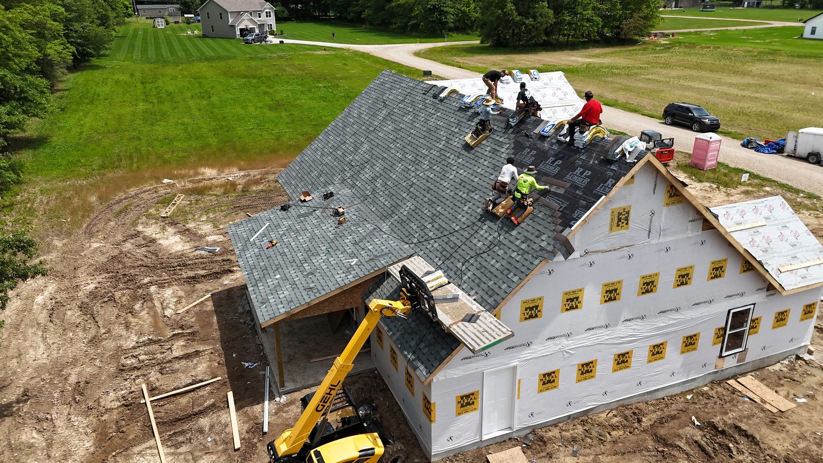 Roofing team — shingles nearly complete